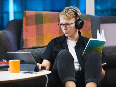 Participant studying using a book and tablet